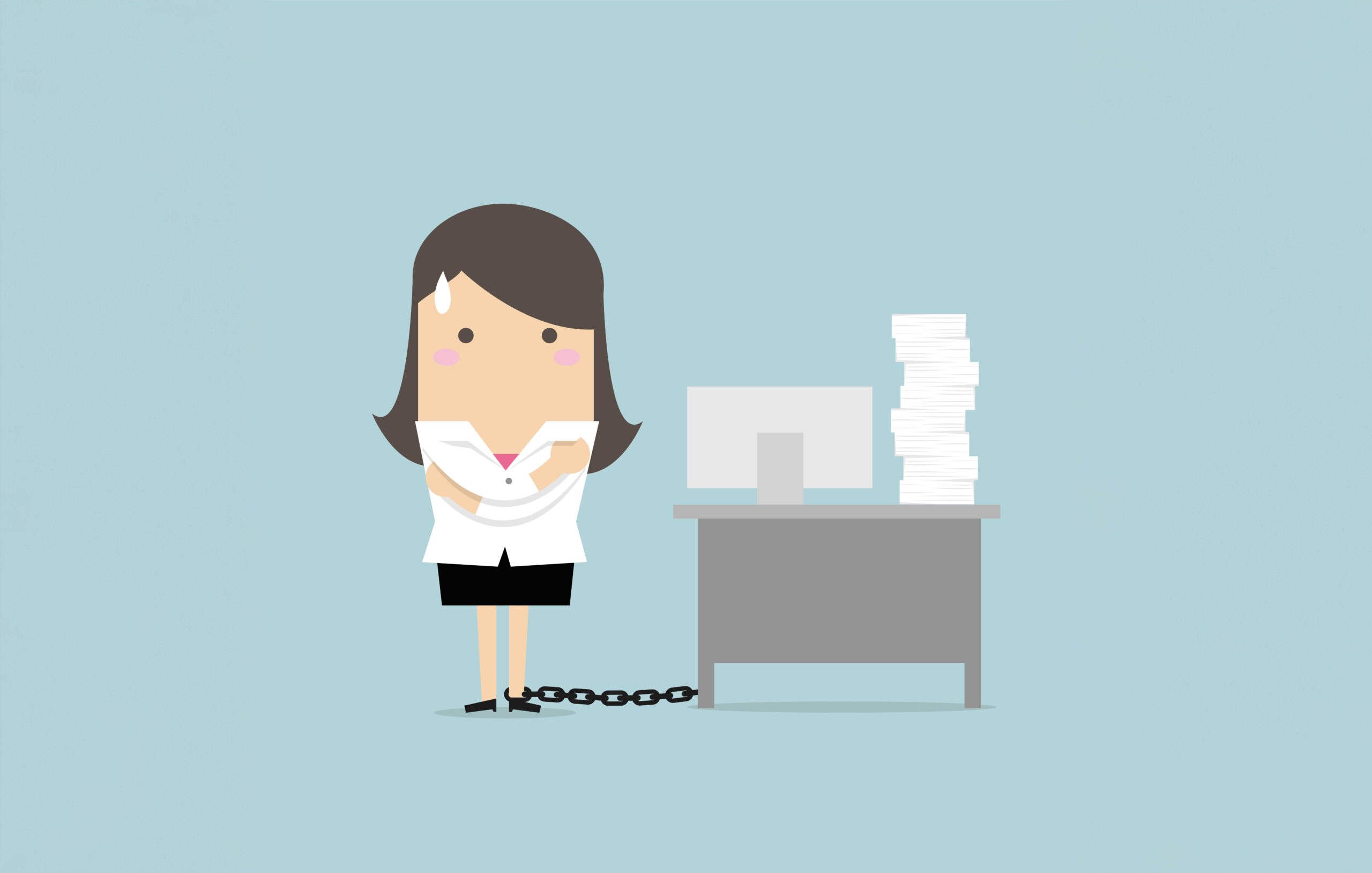 Symbolbild Job Hugging: Weibliche Angestellte ist an ihren Schreibtisch gekettet